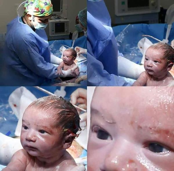 Đáng yêu khoảnh khắc bé trai chào đời giơ tay giải cứu thế giới