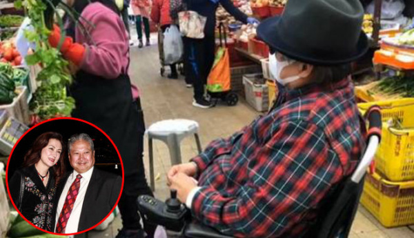 Dân mạng bất ngờ khi Hồng Kim Bảo ngồi xe lăn mua rau cho vợ