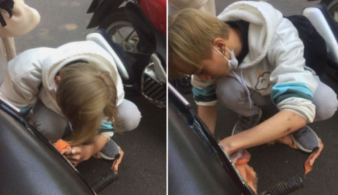 Bất cẩn: Cô gái để khăn chống nắng cuốn vào bánh xe suýt gây tai nạn